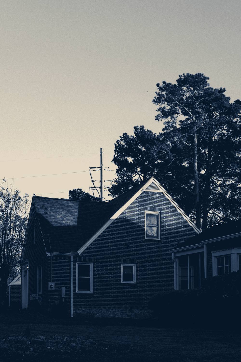 A brick house beside a tree at dusk, Atlanta, Georgia