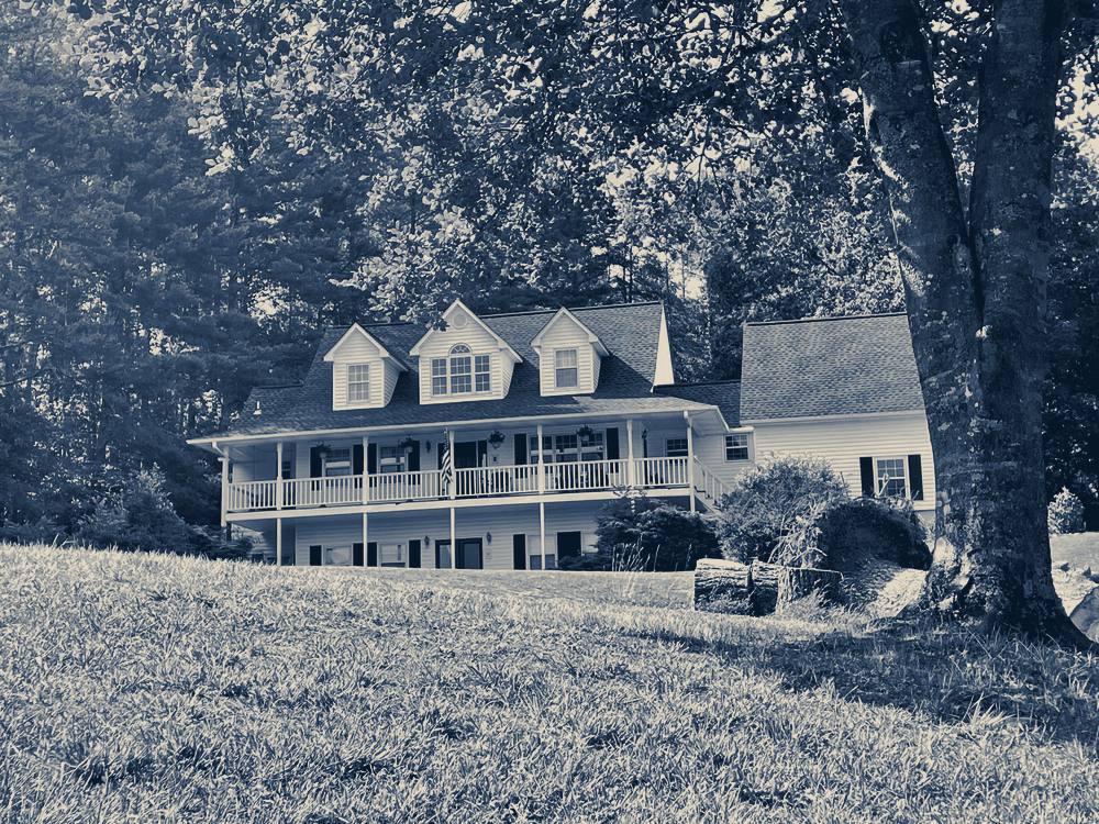 A white house on a green hillside, Blairsville, Georgia